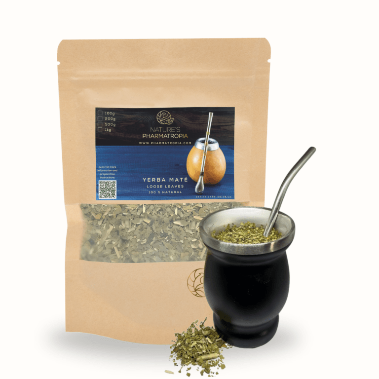 Yerba Maté leaves beside a cup of brewed tea